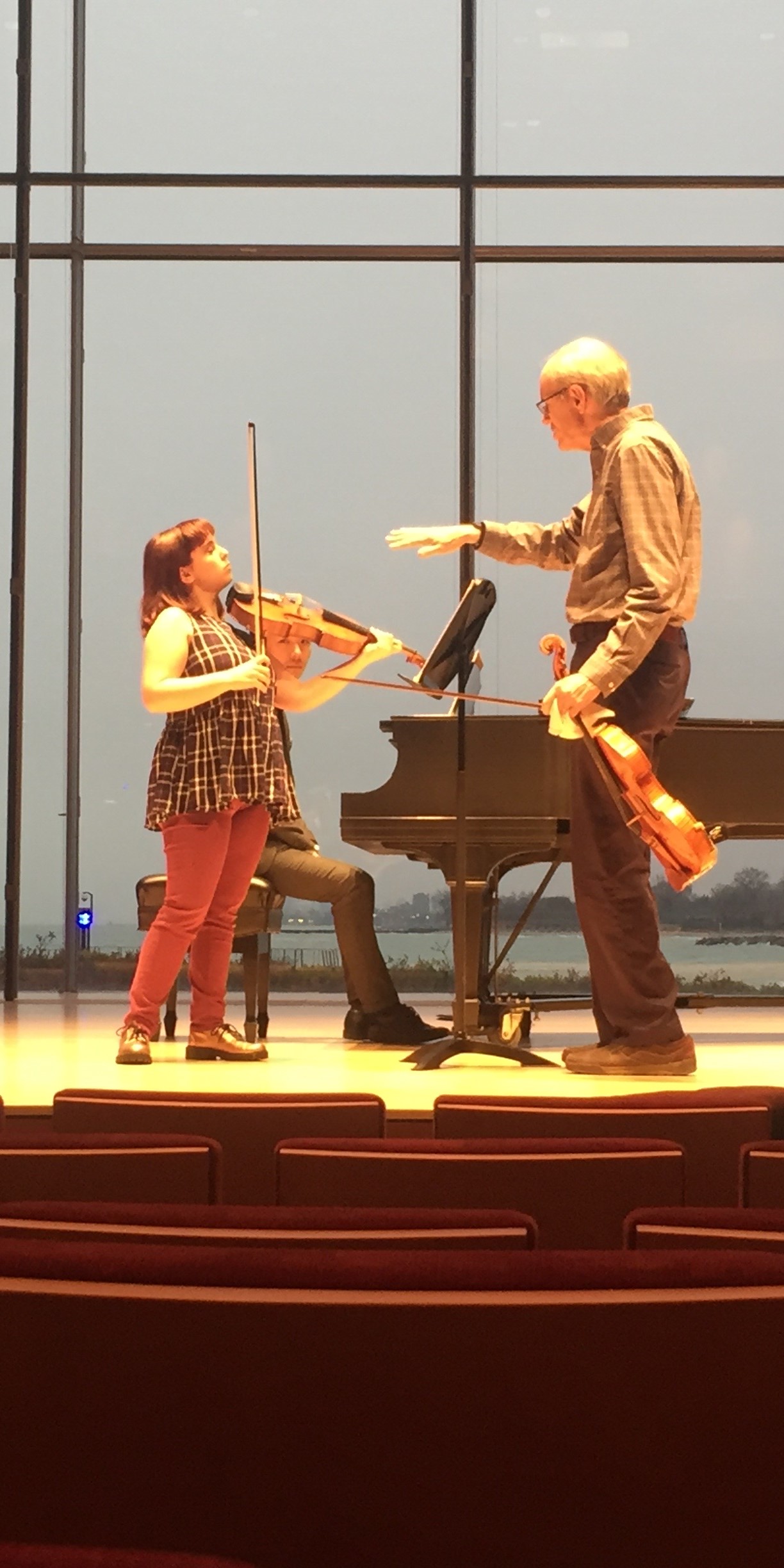 Alexia works with Mr. Irvine in a masterclass.