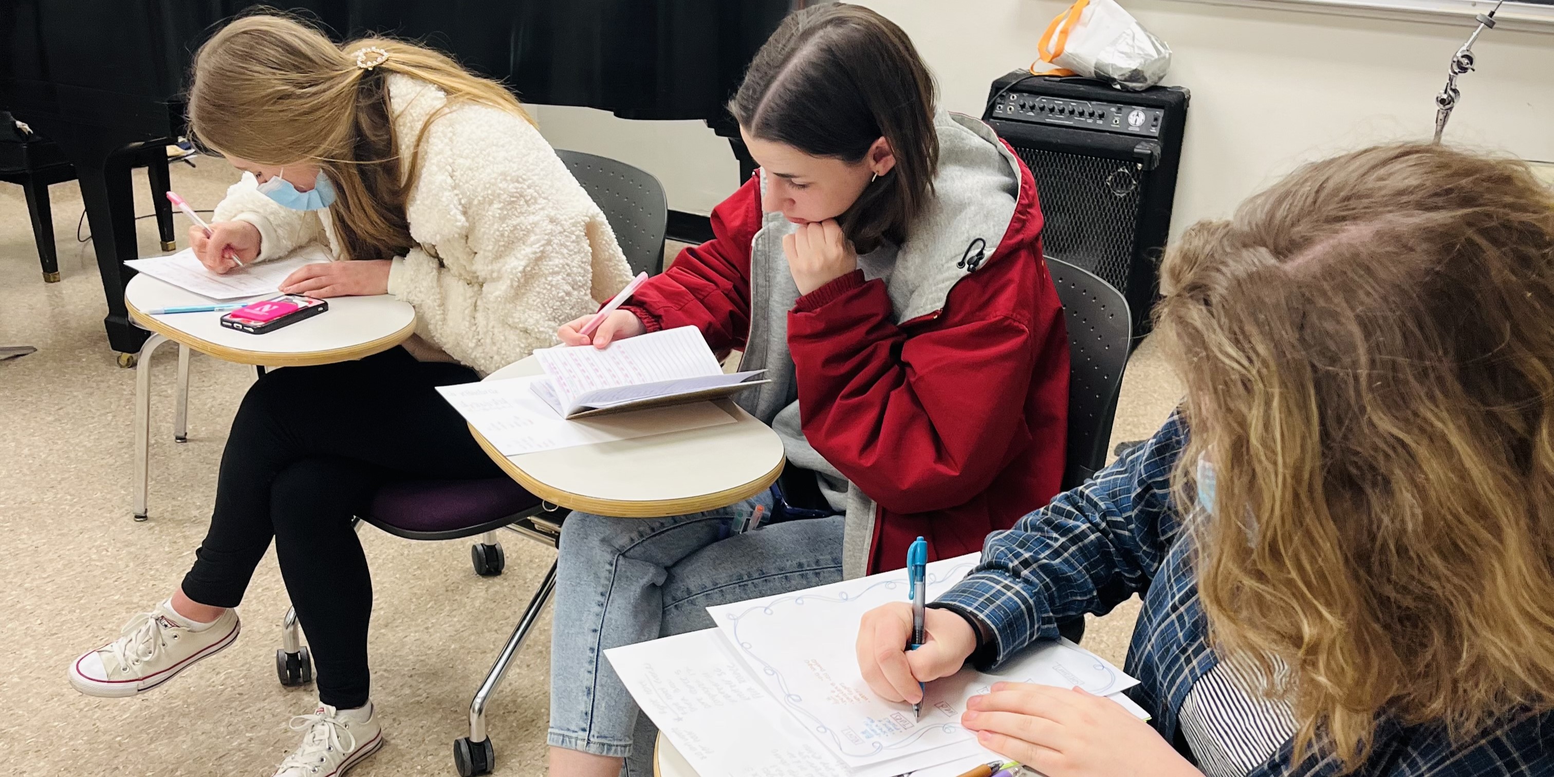 Students working on practice schedules in studio class